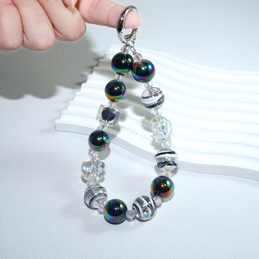 Cat scratching crystal ball mobile phone chain